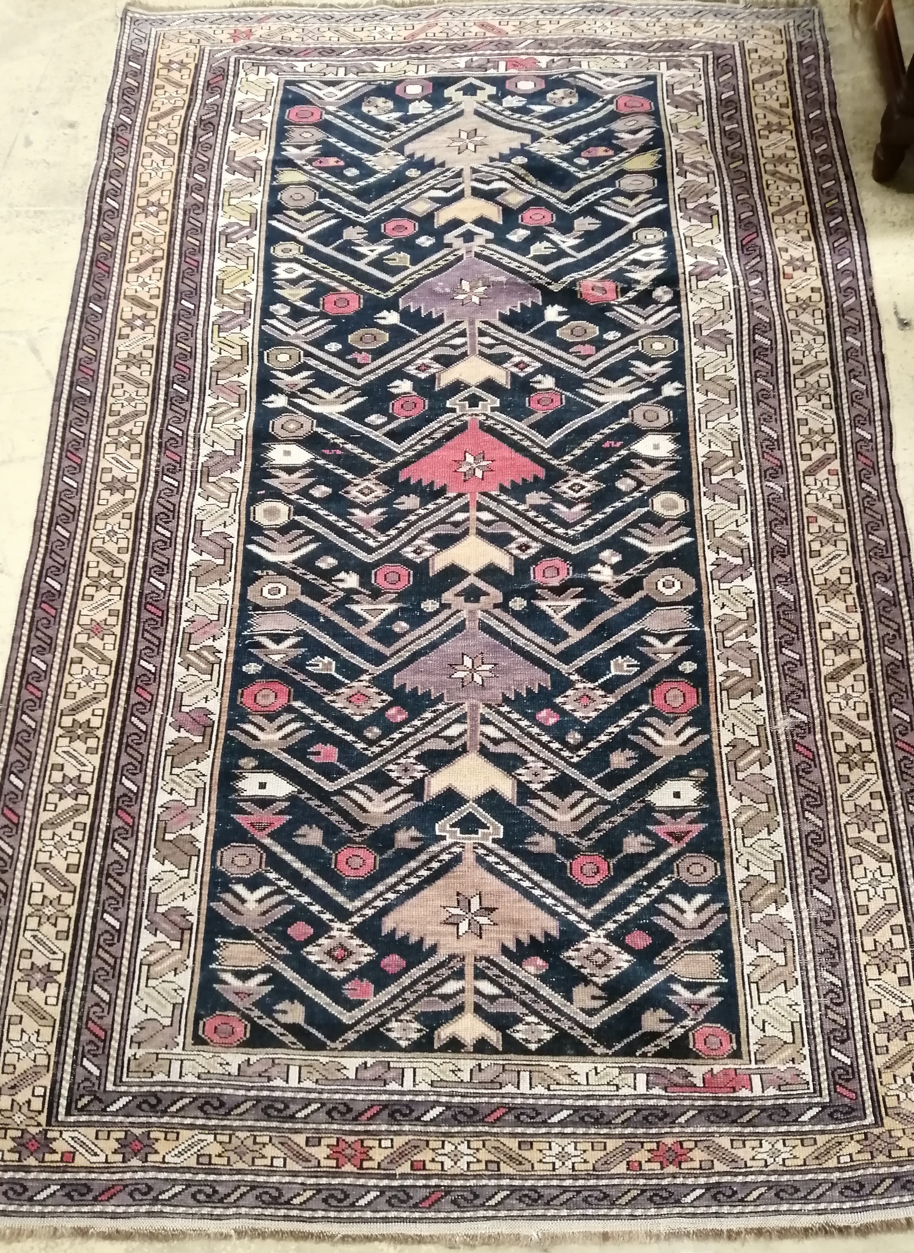 A Caucasian blue ground rug, 180 x 115cm